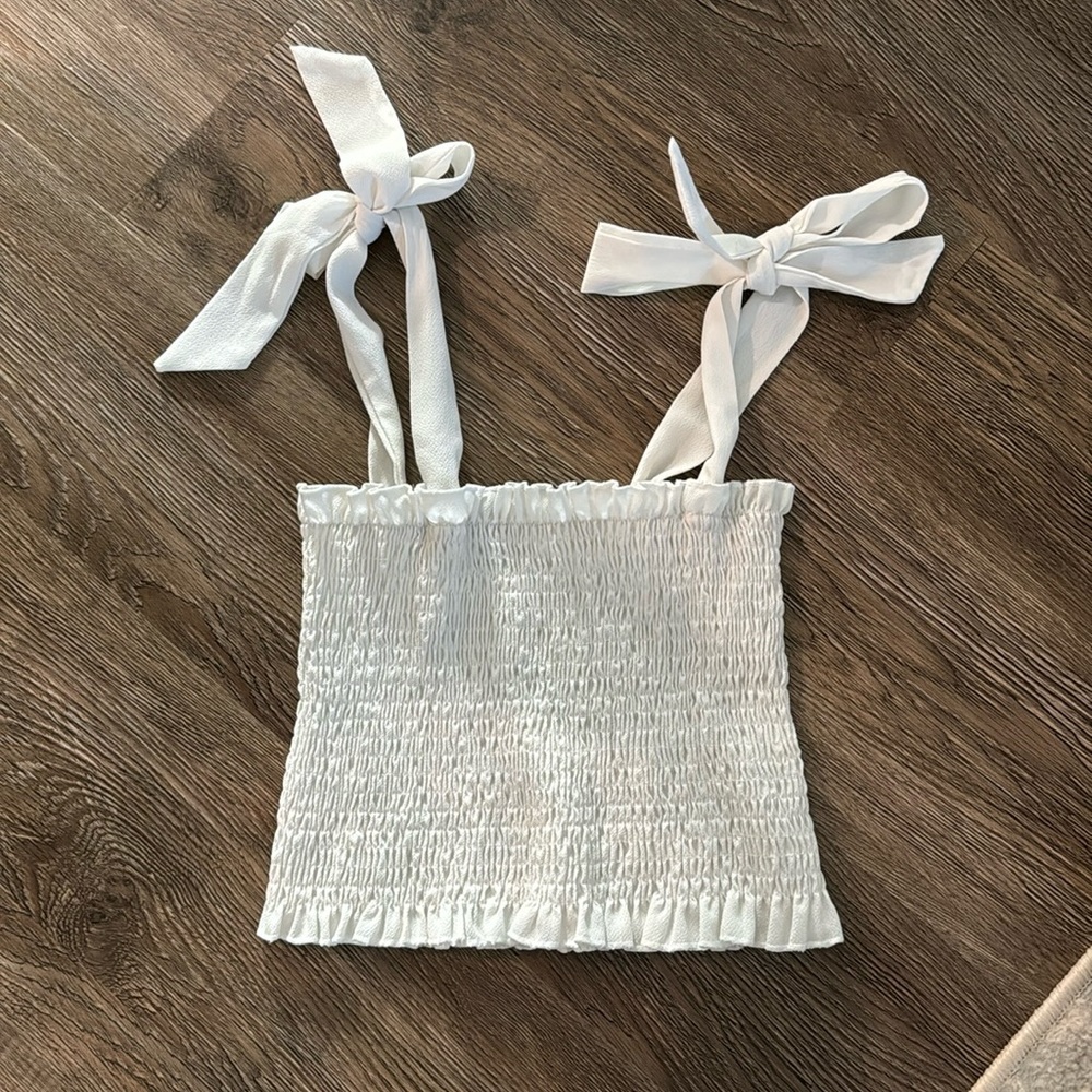 White smocked crop top with adjustable sleeve ties